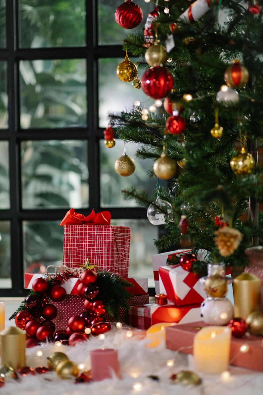 pile of gift boxes under christmas tree